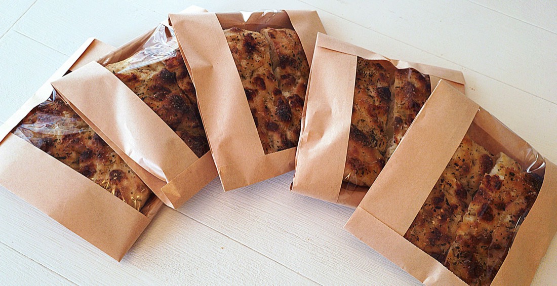 Focaccia slices packed in kraft window bags